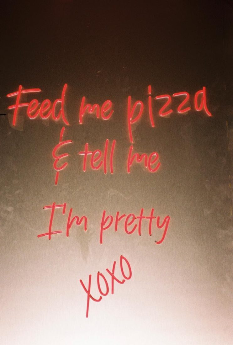 The neon sign: feed me pizza and tell me I'm pretty, xoxo