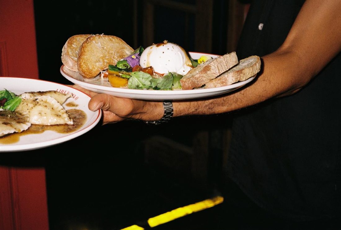 Burrata and bread carried to the table